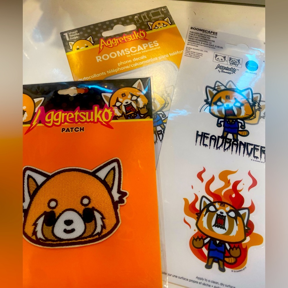 Aggretsuko patch and phone decals